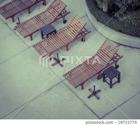 Beach chairs at swimming pool 19715779