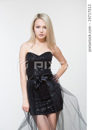 Portrait of beautiful young blonde girl in black Portrait of beautiful young blonde girl in black 19717813