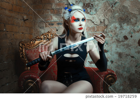 Woman warrior holding a sword in his hand. 19718259