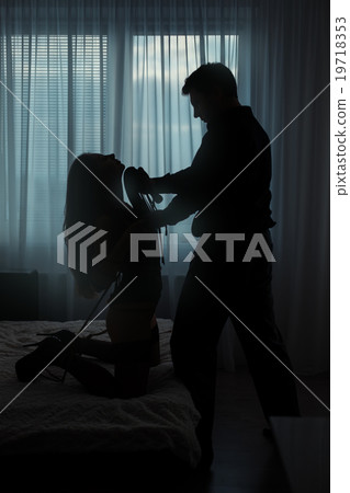 Man torturing a woman. 19718353