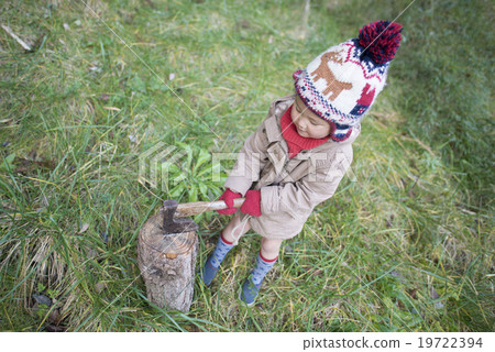 A girl who cuts firewood A girl who cuts firewood 19722394