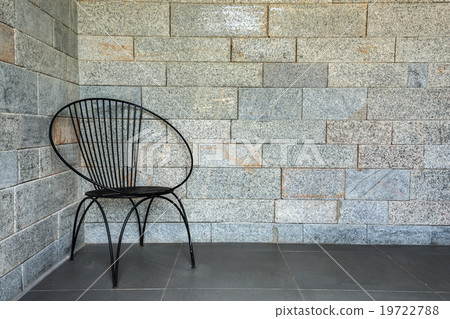 chair with space and brickwall in the background 19722788