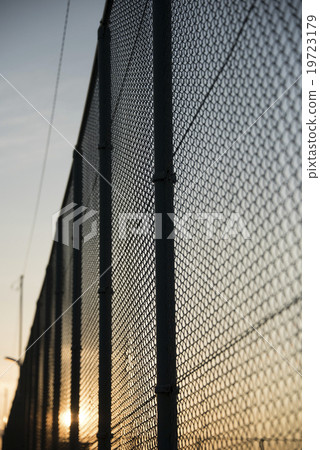 Sunset and fence Sunset and fence 19723179