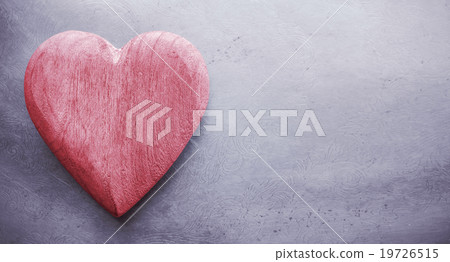 Vintage toned wooden heart on grunge background. 19726515