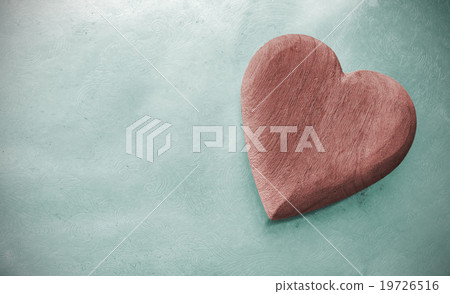 Vintage toned wooden heart on grunge background. 19726516