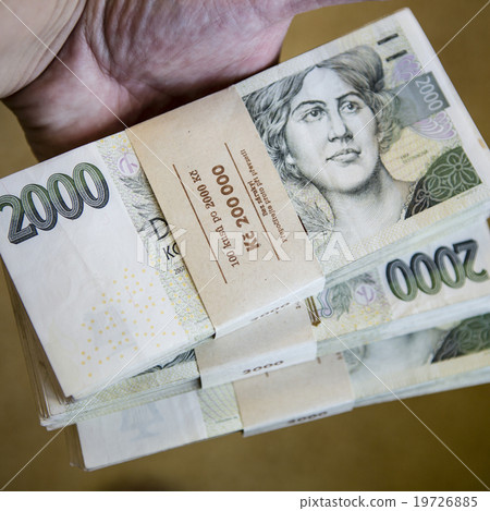 pack of money - big pile of banknotes in hand pack of money - big pile of banknotes in hand 19726885