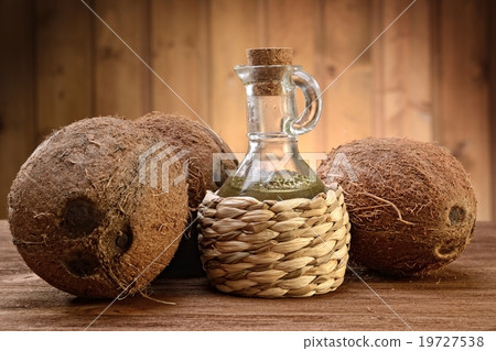 coconut oil on the wooden background 19727538