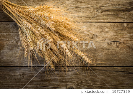 wheat on the wooden background 19727539