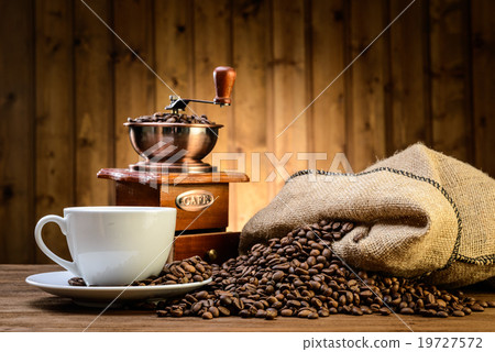 still life with coffee beans and old coffee mill  19727572