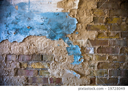 Old brick wall with the damaged plaster 19728049
