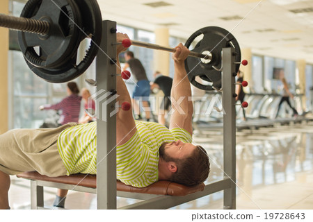 Strong man with barbell. Strong man with barbell. 19728643