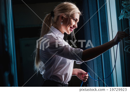 Young engineer businesswoman in server room Young engineer businesswoman in server room 19729923
