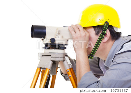 Surveyor worker making measurement and isolated on white Surveyor worker making measurement and isolated on white 19731587