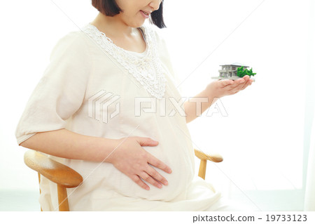 Pregnant woman with model of house Pregnant woman with model of house 19733123