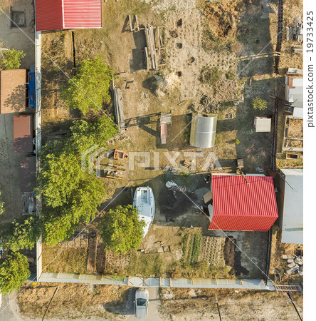 Aerial view on ground plot with cottage. Russia Aerial view on ground plot with cottage. Russia 19733425
