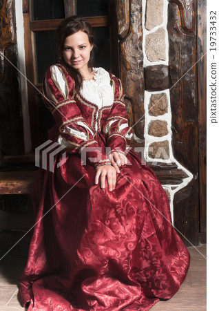 Pretty woman in red dress in retro baroque style Pretty woman in red dress in retro baroque style 19733432