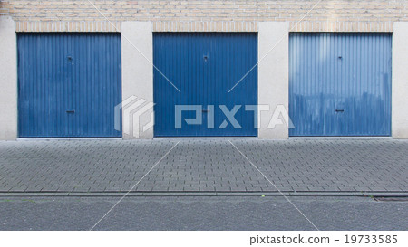 Old blue door of a garage 19733585