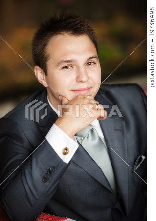 young business man on a desk young business man on a desk 19736498