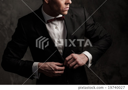 Sharp dressed fashionist wearing jacket and bow tie 19740027