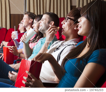 happy Young people watching a movie at the cinema happy Young people watching a movie at the cinema 19740203