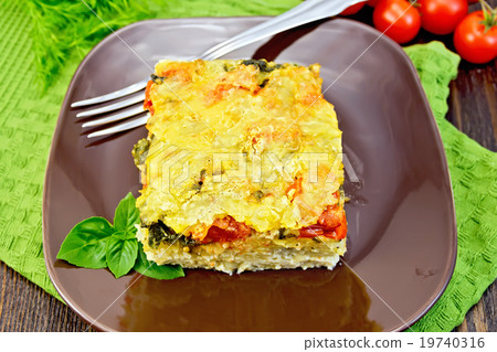 Pie potato with tomato on dark board Pie potato with tomato on dark board 19740316