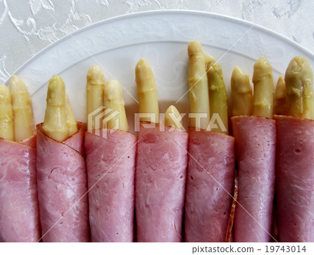 Ham rolls with asparagus on a plate. Dutch snacks. 19743014