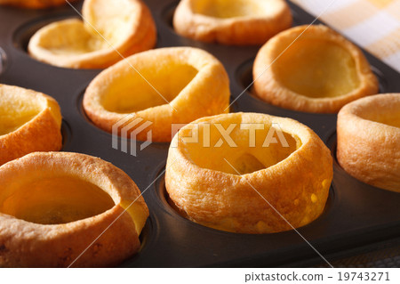 Yorkshire puddings in baking dish macro horizontal 19743271