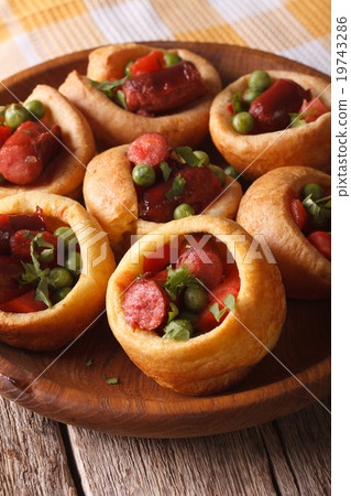 homemade Yorkshire pudding with sausages close-up 19743286