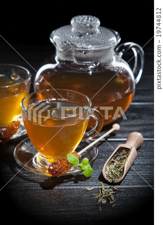 Cup of tea on dark background 19744812