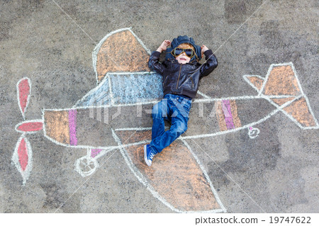 Little boy having fun with airplane picture Little boy having fun with airplane picture 19747622