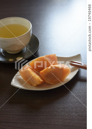 Persimmon and tea Persimmon and tea 19748466