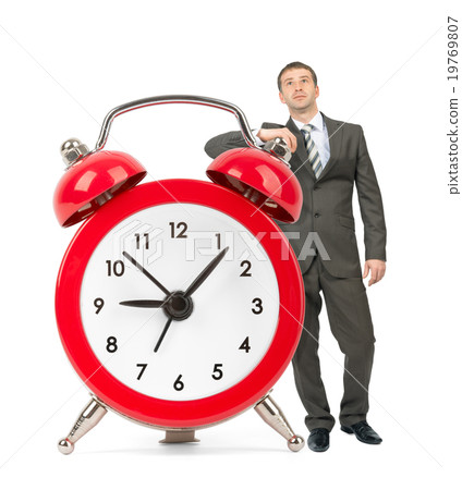 Businessman with big alarm clock 19769807