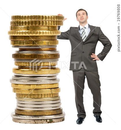 Businessman with big stack of coins 19769808
