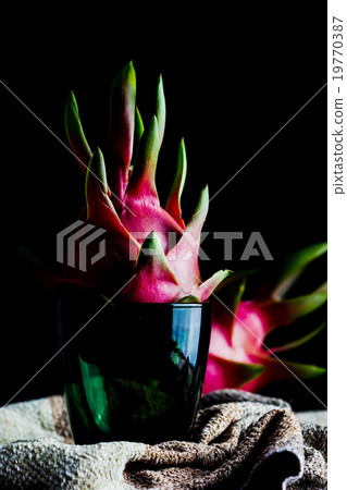 Dragon Fruit in glass on black background 19770387