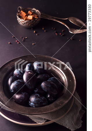 Fresh plums in natural light setting  19773380