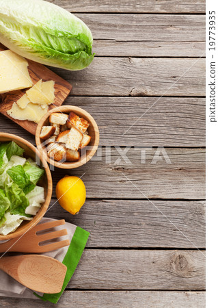 Fresh healthy caesar salad cooking Fresh healthy caesar salad cooking 19773935