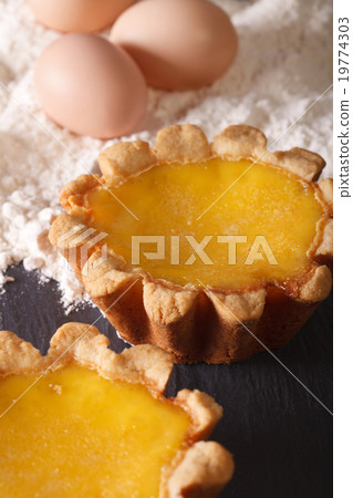 Egg Tart and ingredients on the table macro 19774303