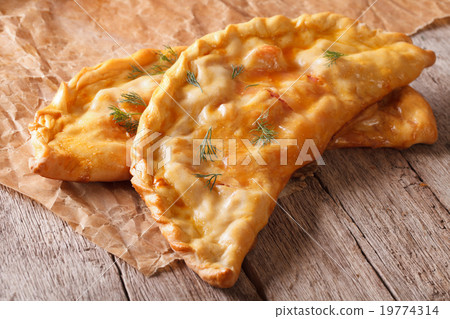 Pizza calzone close-up on the table. horizontal Pizza calzone close-up on the table. horizontal 19774314