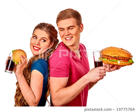 Man and woman eating big sandwich with cola Man and woman eating big sandwich with cola 19775764