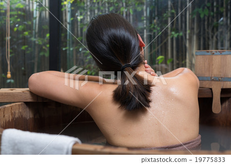 Onsen series : Unrecognizable woman in wooden bath 19775833