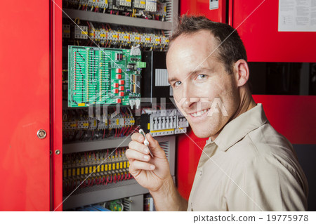 machinist worker technicians at work adjusting 19775978