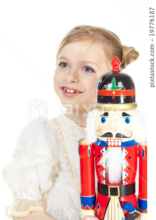 Ballerina who holding a nutcracker Ballerina who holding a nutcracker 19776187