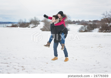 Two teenagers havinf fun on the snow field 19776989