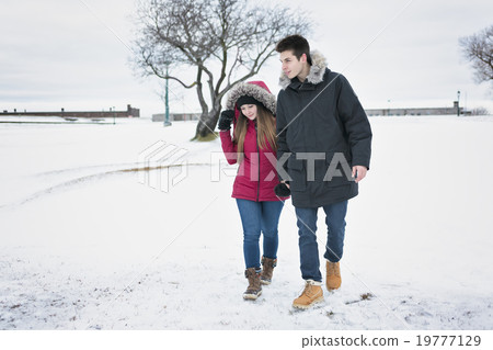 Two teenagers havinf fun on the snow field 19777129