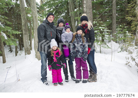Happy family walks and playing with snow in winter Happy family walks and playing with snow in winter 19777674
