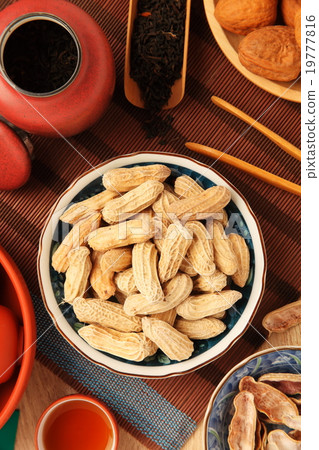 Chinese tea with peanuts on the wood table 19777816