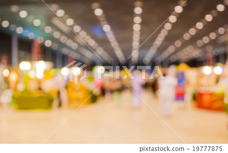 blurred image of people at trade show 19777875
