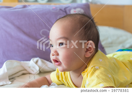 Portrait of happy asian baby on the bed Portrait of happy asian baby on the bed 19778381