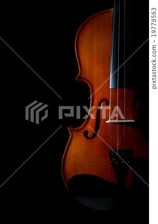 Closeup Violin orchestra musical instruments on black background Closeup Violin orchestra musical instruments on black background 19778563