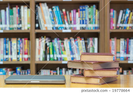 old book on the desk in library with tablet old book on the desk in library with tablet 19778664